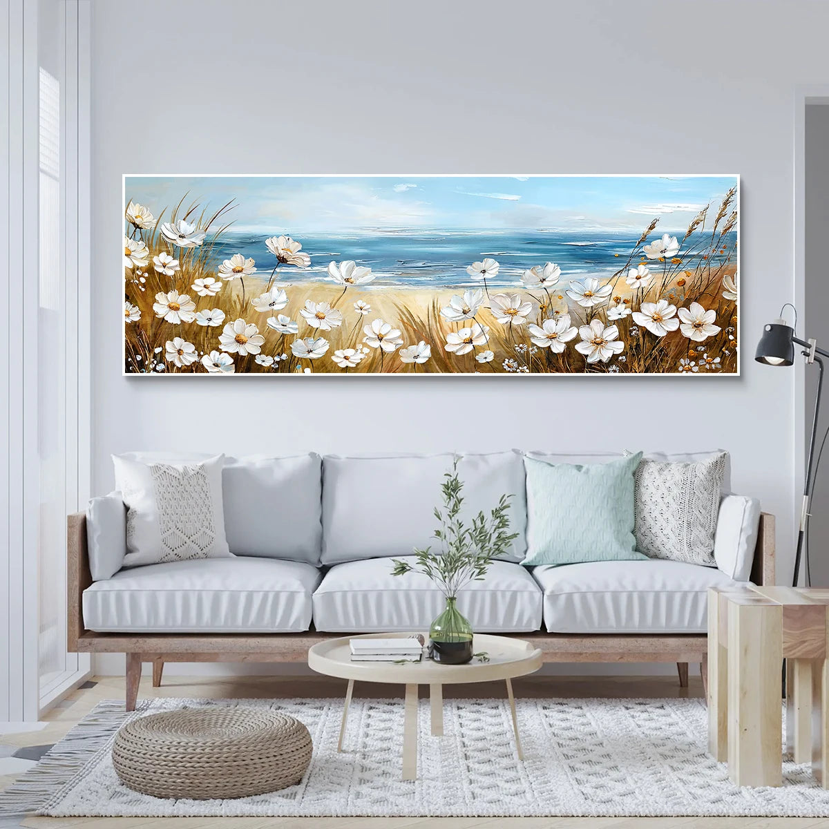 This paired canvas set blends a serene beach scene with white flowers and grasses against a calm ocean.