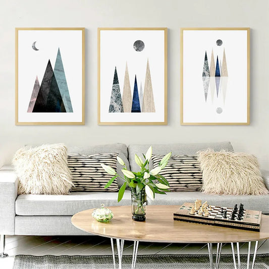 A trio of serene, minimalist digital illustrations depicting stylized triangular mountain ranges with textured, marble-veined surfaces in muted earth and cool tones.