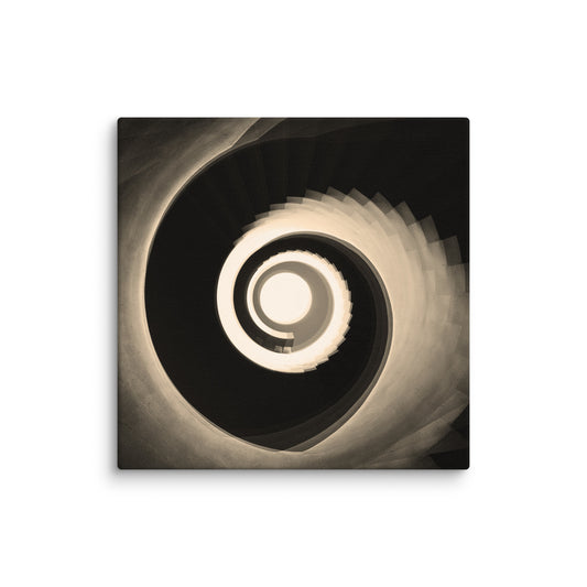 Sepia-toned view looking up a grand spiral staircase, with smooth curving steps and ornate railings forming perfect concentric circles that draw the eye.